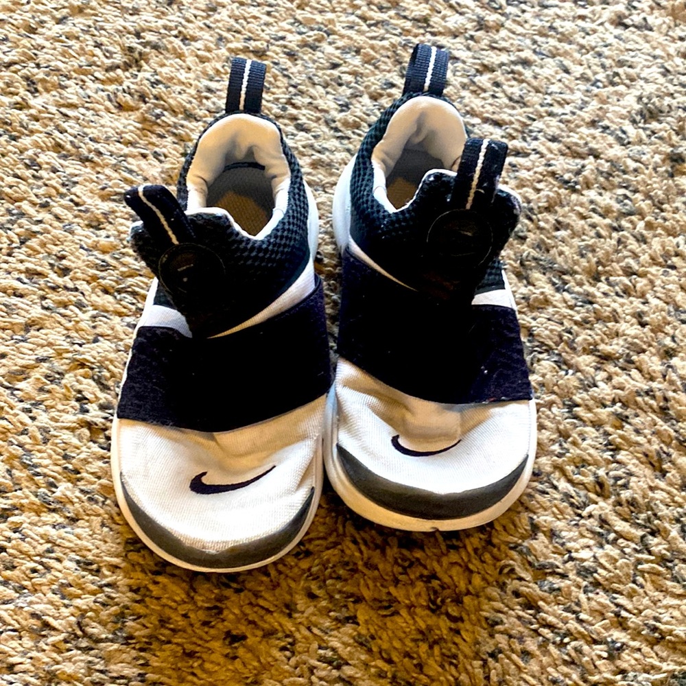 Used condition Nike Shoes size 12C. See pictures for worn areas.